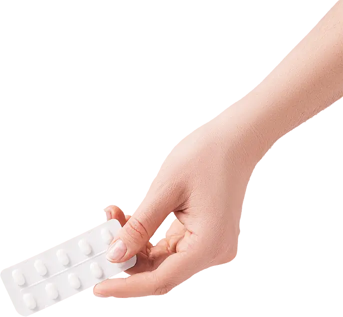 Hand holding pills in their wrapping